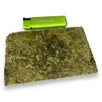 Size comparison of a Thai premium brick weed next to a lighter.